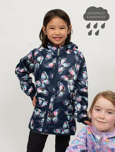 Girls Navy pink & purple butterfly print lined waterproof raincoat on model. Perfect for spring rain days and lightweight jacket.
