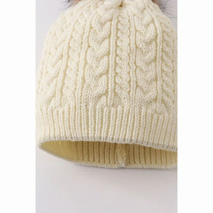 cream cable knit pom pom hat for children close up