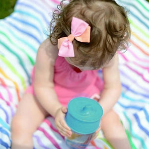 GoSili Universal Sippy Top Lid ~ Turn any cup into a sippy cup! Held by baby.
