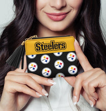Load image into Gallery viewer, Pittsburgh Steelers NFL Black Logo Tassel Wallet. Model Holding Wallet for Size.