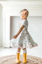 Load image into Gallery viewer, Blue Pink Bunny Eyelet Twirl Dress Easter girl twirling.