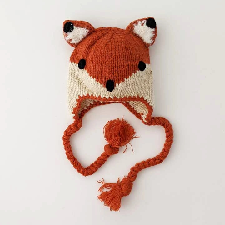 Hand knit orange cream fox baby hat with braided ties and ear flaps. 