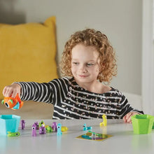 Load image into Gallery viewer, Grab that Monster Fine Motor Game. Educational Toy. Child playing with it.