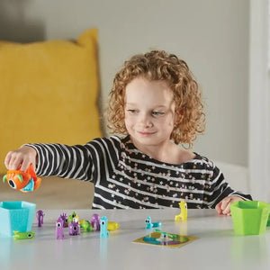Grab that Monster Fine Motor Game. Educational Toy. Child playing with it.