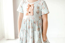 Load image into Gallery viewer, Blue Pink Bunny Eyelet Twirl Dress Easter Girls close up.